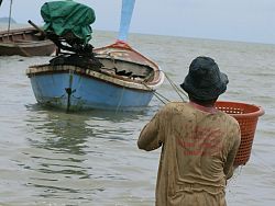Fisherman & longtail boat