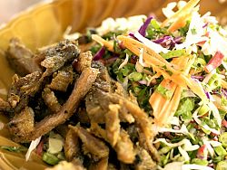 The local dish, khao yam, is best described as a rice salad with vegetables and herbs