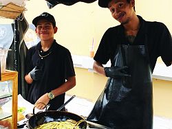 Grinning short order chefs