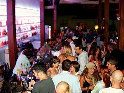A crowd of people enjoying a bar atmosphere