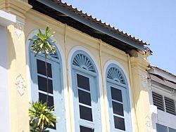 Charming Old Town's Sino-Portuguese buildings with wooden shutters