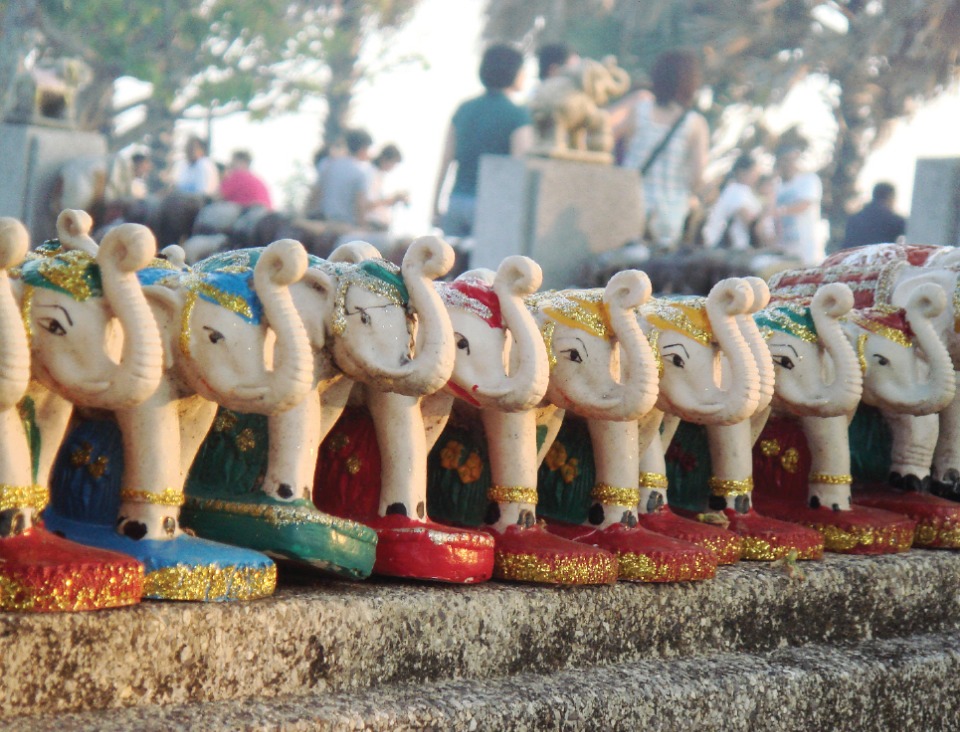 The Elephant Shrine at Promthep Cape is lined with various elephant statues and carvings