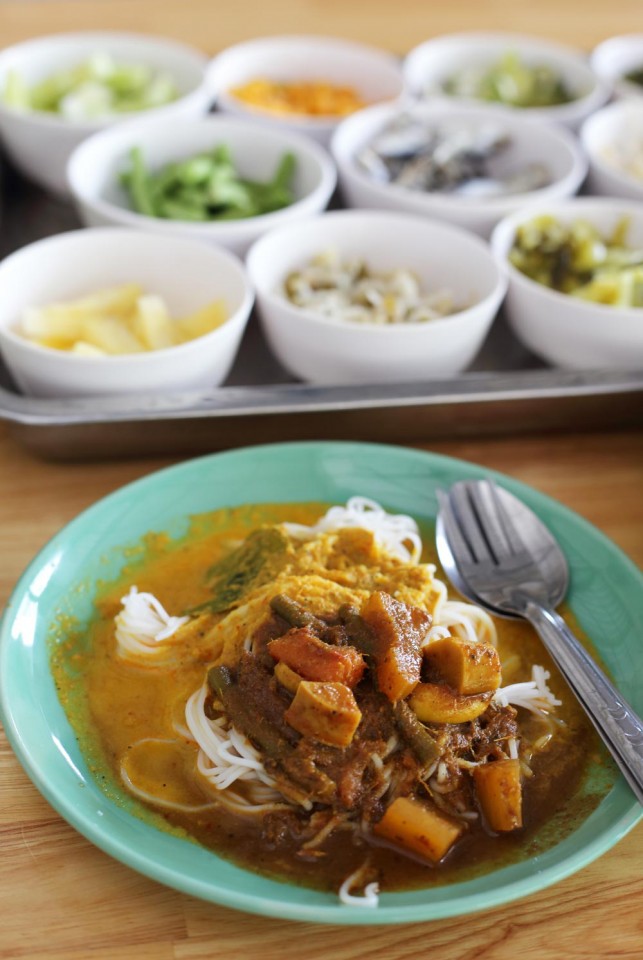 Kanom Jeen is a rice noodle dish served with fresh, local vegetables and spicy fish curry. It is delicious!