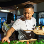 Chef Rey Ardonia, The Pavilions Phuket Culinary Director, prepares beer-battered NZ green-lipped mussels with sweet potato chips.